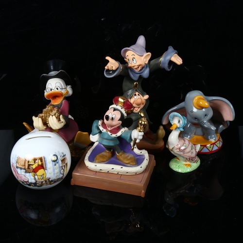 490 - A group of Disney figures, including Mickey Mouse and Donald Duck, a Winnie The Pooh money box, and ... 