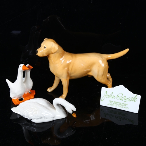 516 - A Beswick Golden Labrador, a pair of geese, a swan, and a Beswick sign
