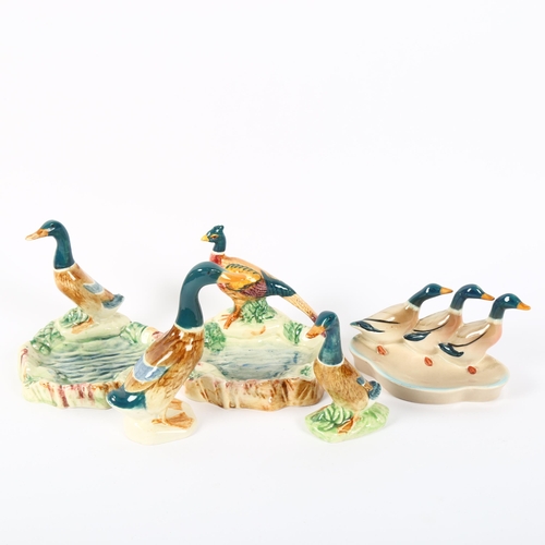 525 - A group of small Beswick ducks and a pheasant by a pond, height 9cm