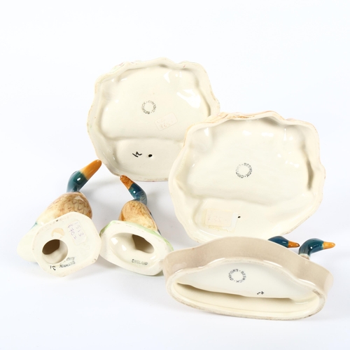 525 - A group of small Beswick ducks and a pheasant by a pond, height 9cm