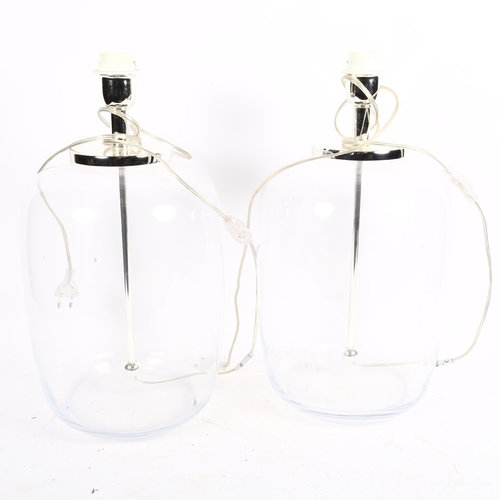 772 - A pair of clear table lamps, with matching cream shades