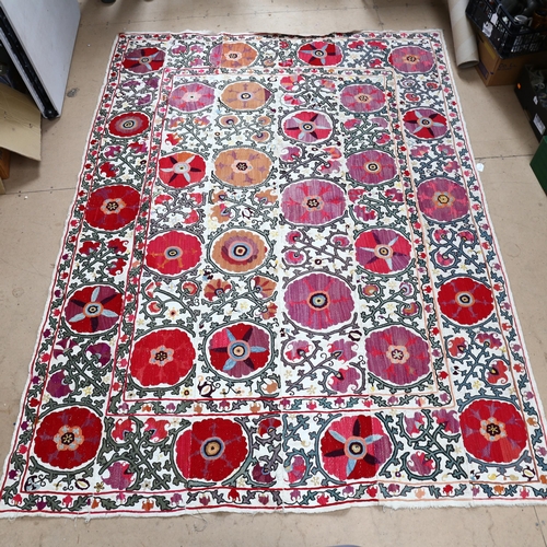 779 - A large embroidered panel depicting flowers and foliage, 149cm x 180cm