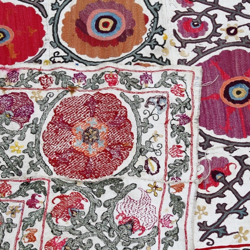 779 - A large embroidered panel depicting flowers and foliage, 149cm x 180cm