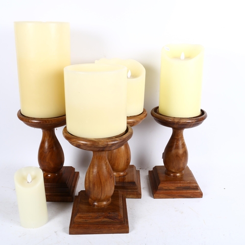 808 - A set of 4 Oka turned wood candle stands