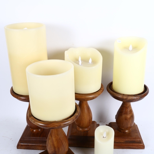 808 - A set of 4 Oka turned wood candle stands