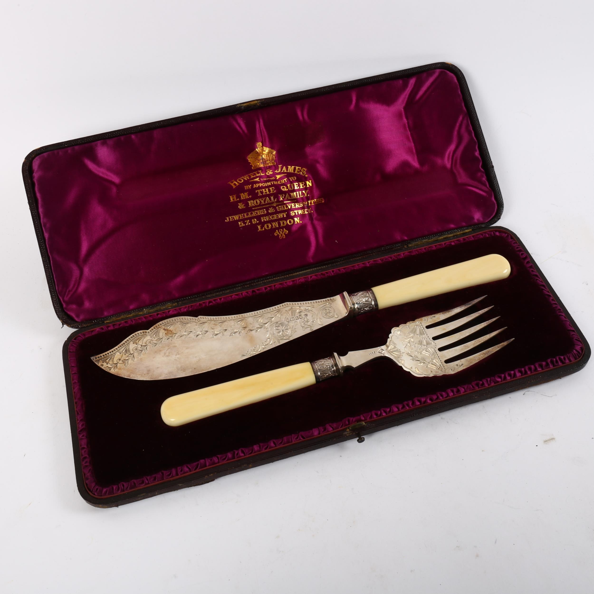 Victorian silverbladed and ivoryhandled fish servers, with engraved