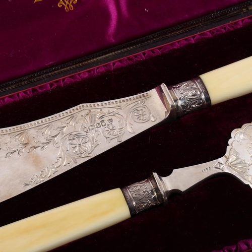 Victorian silverbladed and ivoryhandled fish servers, with engraved
