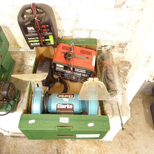 2779 - A box containing a bench grinder, jack, 2 car battery chargers etc