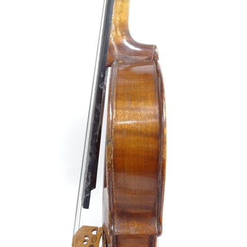 347 - A Vintage violin, globe sticker inside, body length 36cm, with bow, in hardshell case