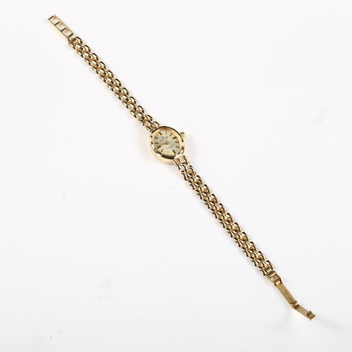 63 - SOVEREIGN - a lady's 9ct gold quartz bracelet watch, champagne dial with gilt baton hour markers and... 