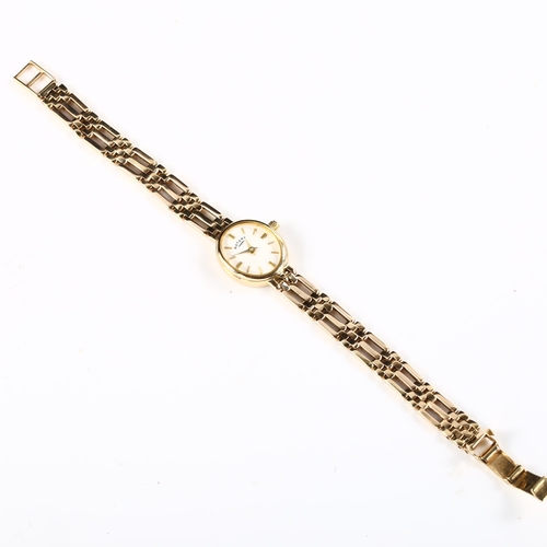 64 - ROTARY - a lady's 9ct gold quartz bracelet watch, white dial with gilt baton hour markers and 9ct br... 