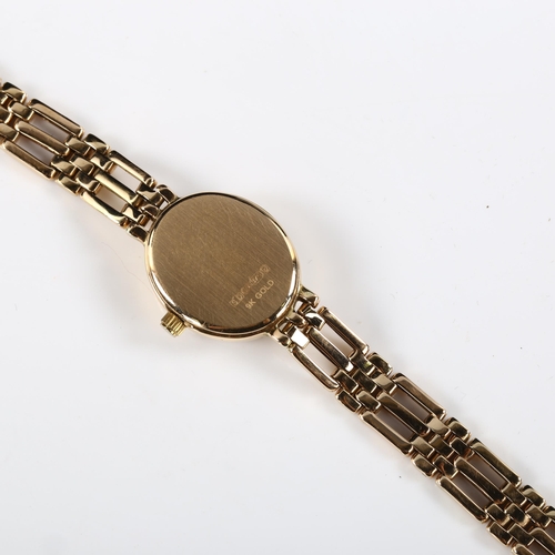 64 - ROTARY - a lady's 9ct gold quartz bracelet watch, white dial with gilt baton hour markers and 9ct br... 