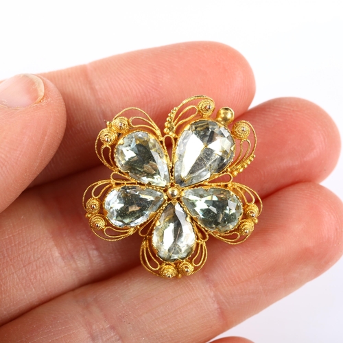 100 - A 19th century chrysoberyl flowerhead brooch, unmarked gold wirework cannetille decoration with pear... 