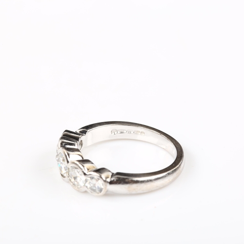 104 - An 18ct white gold graduated five stone diamond ring, set with modern round brilliant-cut diamonds, ... 