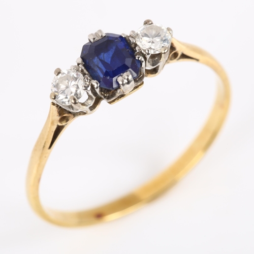 113 - A three stone sapphire and diamond ring, unmarked gold settings with emerald-cut sapphire and modern... 