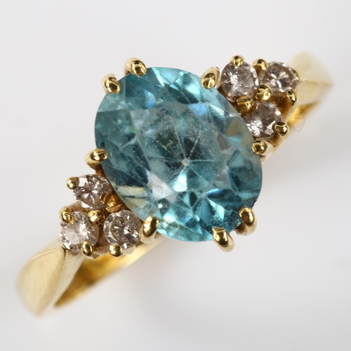 117 - A late 20th century 18ct gold blue zircon and diamond dress ring, set with oval mixed-cut zircon and... 