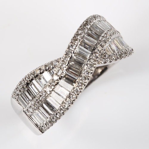 119 - A modern 18ct white gold diamond crossover ring, set with baguette and modern round brilliant-cut di... 