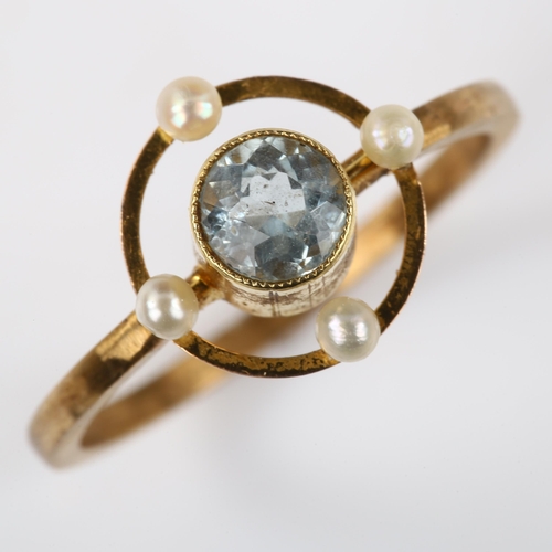 123 - An Edwardian blue topaz and pearl dress ring, unmarked gold settings, 11.1mm, size K/L, 1.9g