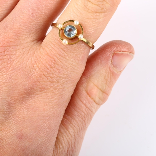 123 - An Edwardian blue topaz and pearl dress ring, unmarked gold settings, 11.1mm, size K/L, 1.9g