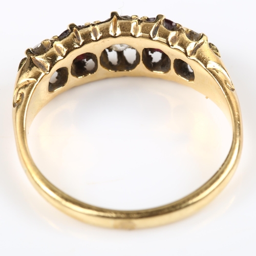 125 - An 18ct gold graduated five stone garnet and diamond half hoop ring, set with round-cut garnets and ... 