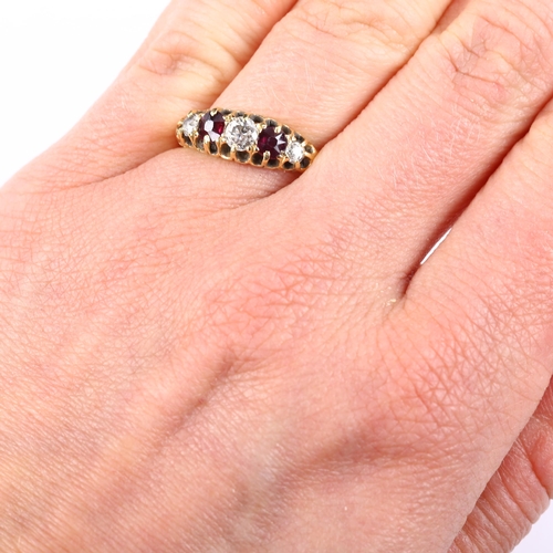 125 - An 18ct gold graduated five stone garnet and diamond half hoop ring, set with round-cut garnets and ... 