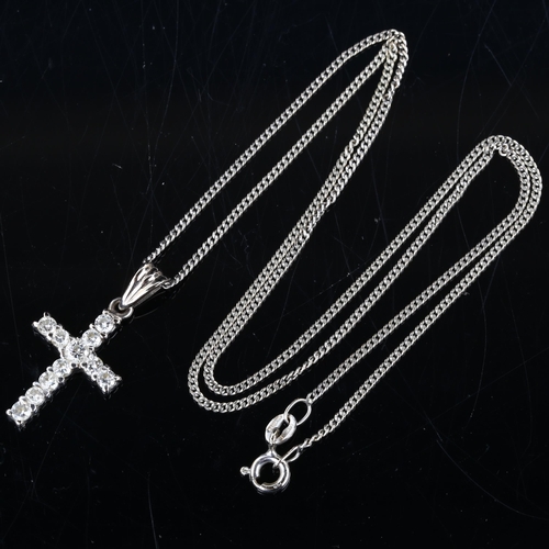 130 - A modern 18ct white gold diamond cross pendant necklace, on 18ct fine curb link chain, pendant heigh... 