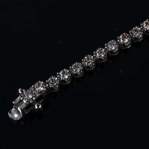 131 - A modern 18ct white gold diamond tennis line bracelet, set with modern round brilliant-cut diamonds,... 