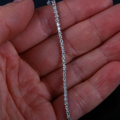 131 - A modern 18ct white gold diamond tennis line bracelet, set with modern round brilliant-cut diamonds,... 