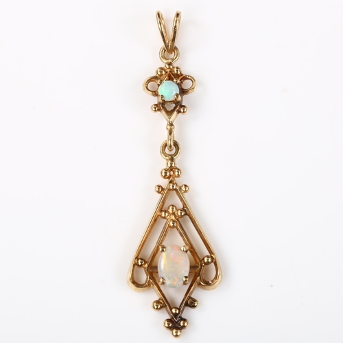 134 - An Edwardian style opal openwork pendant, unmarked gold settings with cabochon opals, pendant height... 