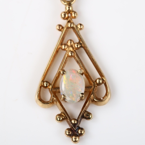 134 - An Edwardian style opal openwork pendant, unmarked gold settings with cabochon opals, pendant height... 