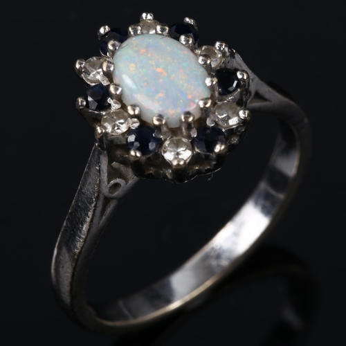 141 - A late 20th century 18ct white gold opal sapphire and diamond cluster ring, set with oval cabochon o... 