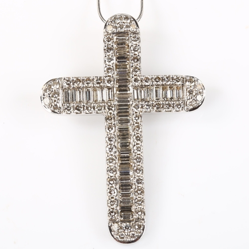 142 - A large modern 18ct white gold diamond cross pendant necklace, set with baguette and modern round br... 