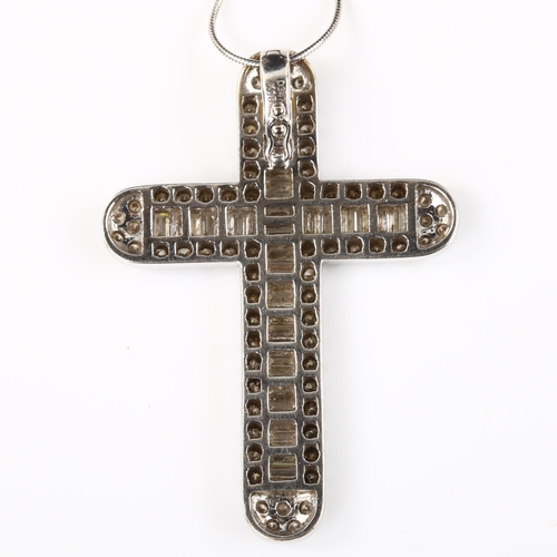 142 - A large modern 18ct white gold diamond cross pendant necklace, set with baguette and modern round br... 