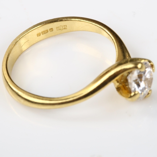 146 - An 18ct gold 0.6ct solitaire diamond ring, crossover claw set with modern round brilliant-cut diamon... 