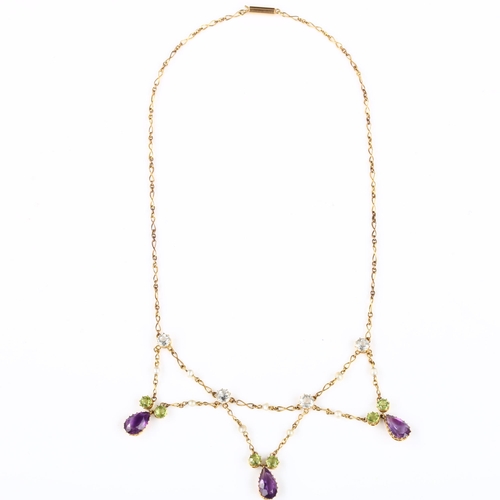 148 - SUFFRAGETTE INTEREST - an Edwardian 9ct gold gem set lavaliere fringe necklace, alternating twisted ... 