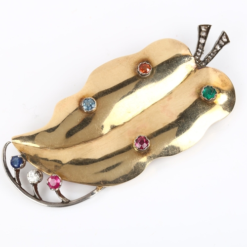 155 - A large Art Deco gem set leaf brooch, unmarked gold and silver settings, gemstones include emerald r... 