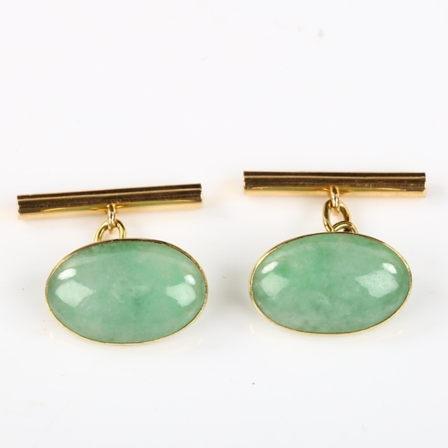 156 - A pair of Chinese 18ct gold jade oval panel cufflinks, panel length 19.1mm, 6.8g