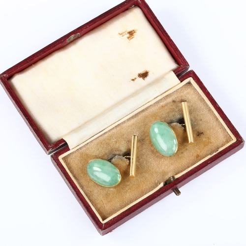 156 - A pair of Chinese 18ct gold jade oval panel cufflinks, panel length 19.1mm, 6.8g