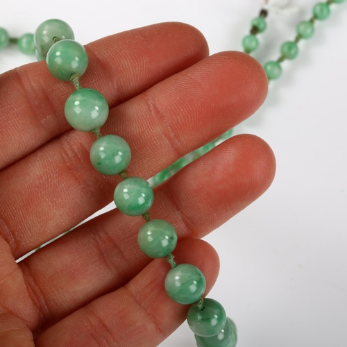 162 - A single-strand graduated jade bead necklace, individually knotted, bead diameters 8.7mm - 4.5mm, ne... 