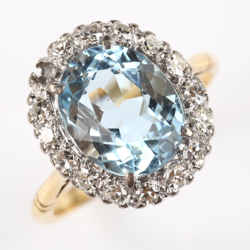 173 - An 18ct gold aquamarine and diamond oval cluster ring, set with oval mixed-cut aqua and single-cut d... 