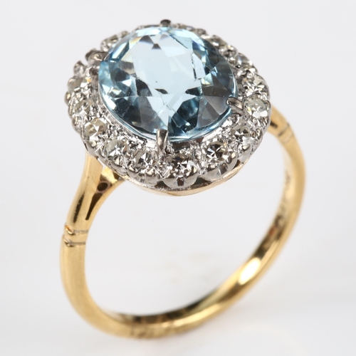 173 - An 18ct gold aquamarine and diamond oval cluster ring, set with oval mixed-cut aqua and single-cut d... 