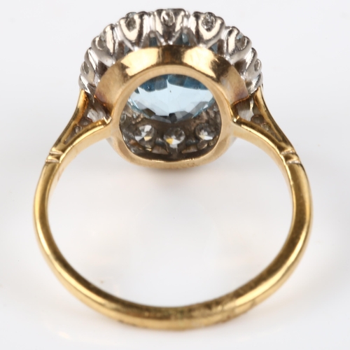 173 - An 18ct gold aquamarine and diamond oval cluster ring, set with oval mixed-cut aqua and single-cut d... 