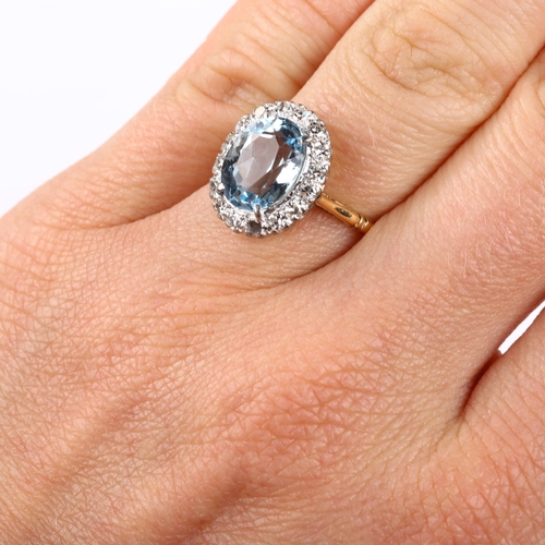 173 - An 18ct gold aquamarine and diamond oval cluster ring, set with oval mixed-cut aqua and single-cut d... 