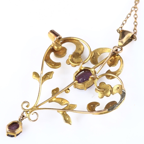 174 - An Art Nouveau 9ct gold amethyst and pearl openwork pendant necklace, on 9ct fine belcher link chain... 