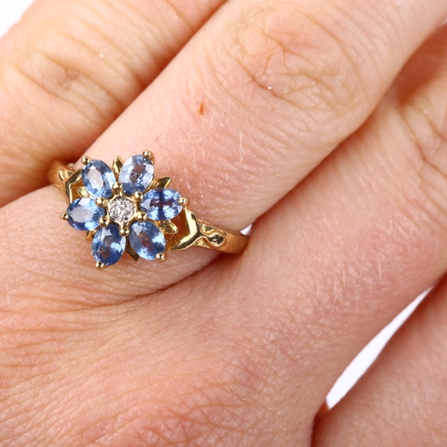 327 - A modern 9ct gold sapphire and diamond flowerhead dress ring, setting height 11.8mm, size N, 2.6g