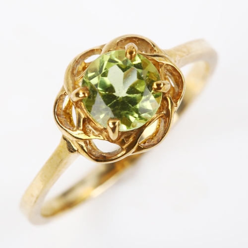 328 - A modern 9ct gold peridot dress ring, setting height 8.9mm, size N, 1.9g