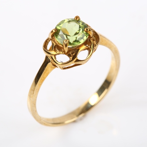 328 - A modern 9ct gold peridot dress ring, setting height 8.9mm, size N, 1.9g