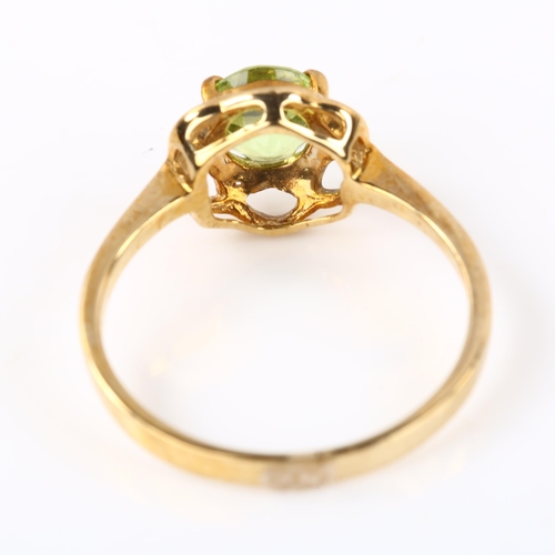 328 - A modern 9ct gold peridot dress ring, setting height 8.9mm, size N, 1.9g