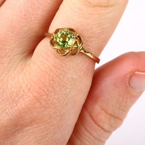 328 - A modern 9ct gold peridot dress ring, setting height 8.9mm, size N, 1.9g