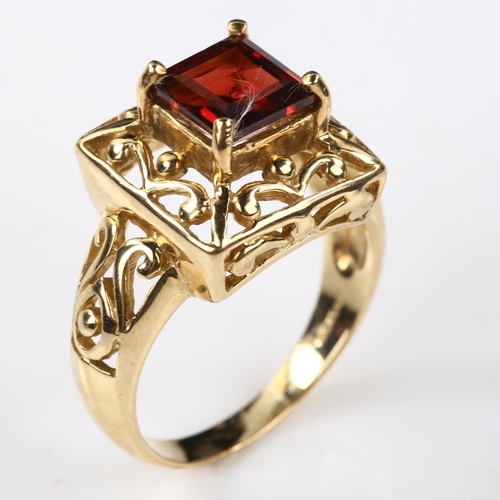 330 - A modern 9ct gold garnet dress ring, setting height 13.6mm, size N, 5.2g